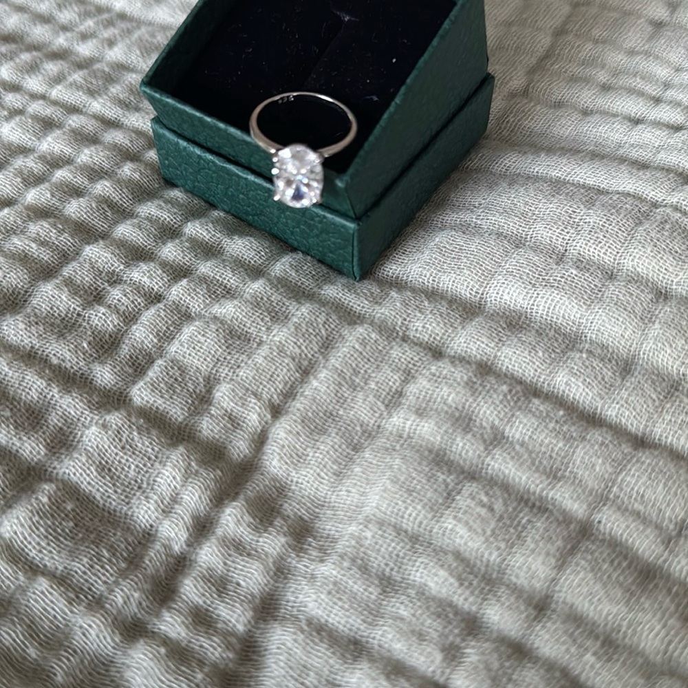 4ct oval moissanite engagement ring. Thin band